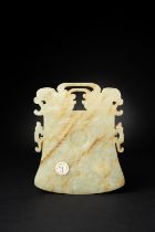 A CHINESE CELADON JADE BELL-SHAPED RITUAL PLAQUE, YUE MING/EARLY QING DYNASTY The plaque carved on