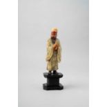 A CHINESE SOAPSTONE FIGURE OF CAO GUOJIU 18TH CENTURY The Daoist Immortal is depicted standing