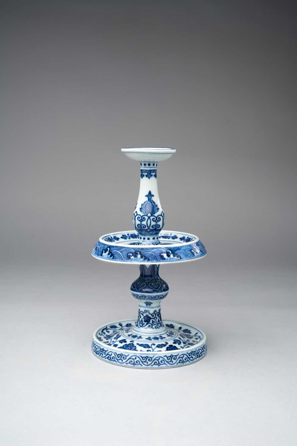 A RARE CHINESE BLUE AND WHITE MING-STYLE ALTAR CANDLESTICK FOUR-CHARACTER QIANLONG MARK AND OF THE