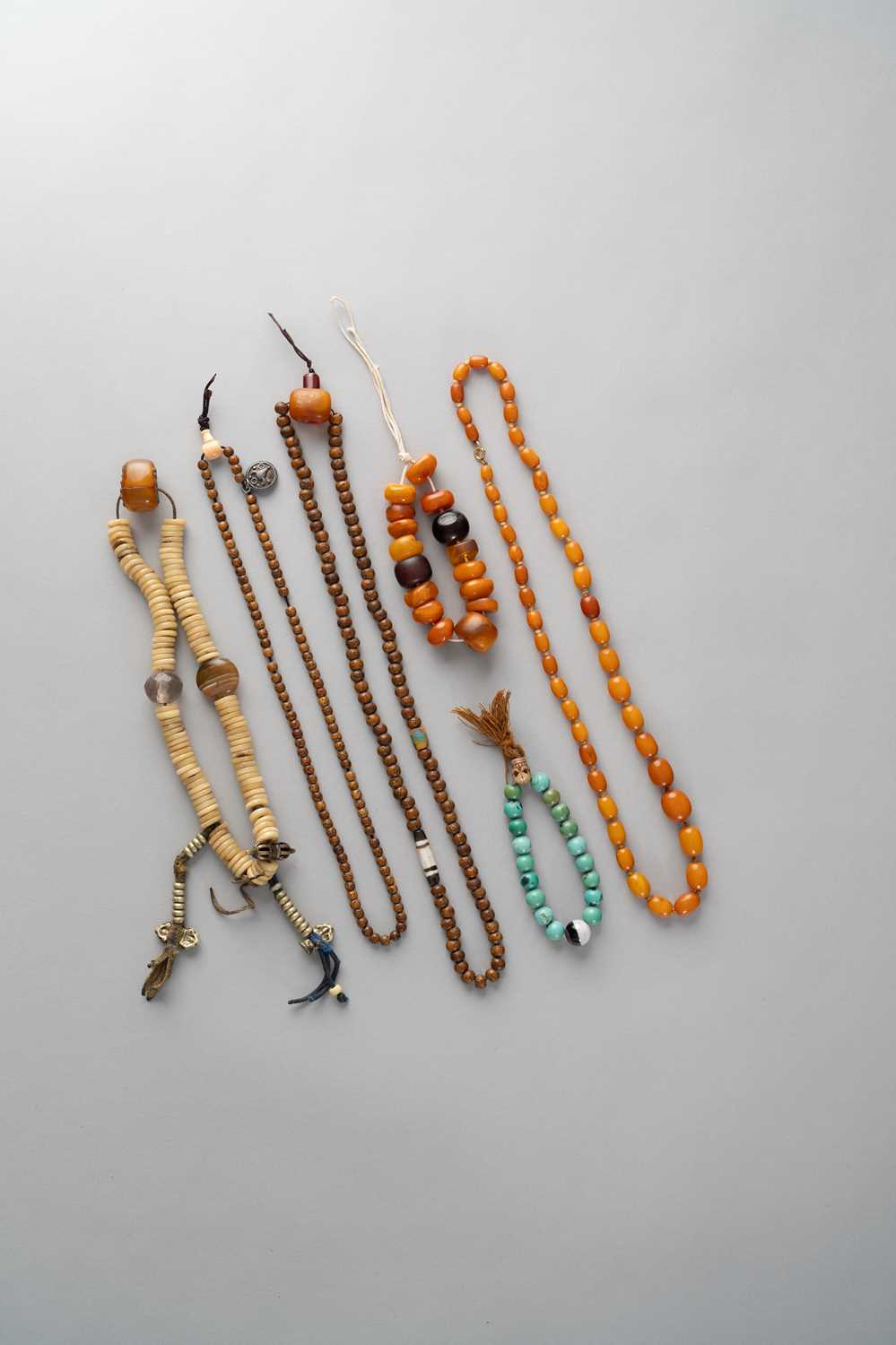 NO RESERVE λ FOUR SINO-TIBETAN NECKLACES AND TWO BRACELETS 19TH/20TH CENTURY Variously composed of