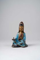 A CHINESE CHAMPLEVE ENAMEL FIGURE OF GUANYIN QING DYNASTY Dressed in flowing robes decorated with
