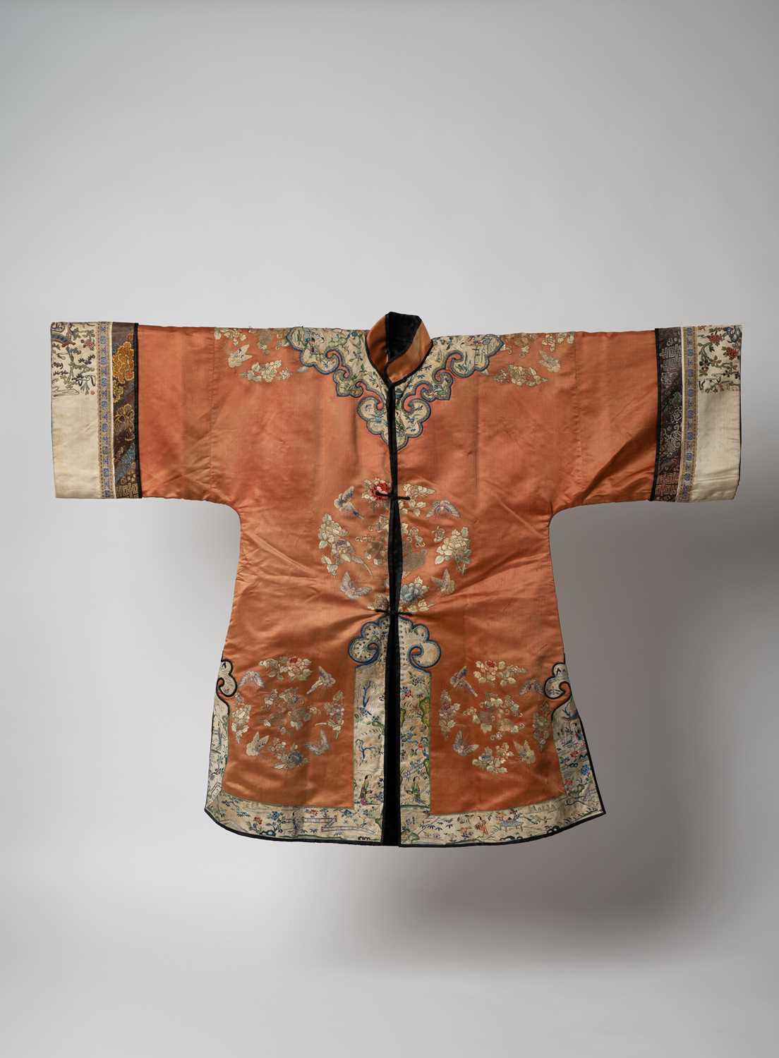 A CHINESE EMBROIDERED SILK MARRIAGE SURCOAT, PAO LATE QING DYNASTY The front-opening robe widening