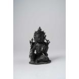 A CHINESE BRONZE FIGURE OF A BODHISATTVA LATE MING DYNASTY Seated in lalitasana, with her right hand