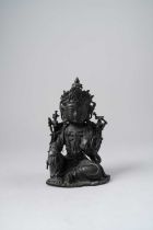 A CHINESE BRONZE FIGURE OF A BODHISATTVA LATE MING DYNASTY Seated in lalitasana, with her right hand