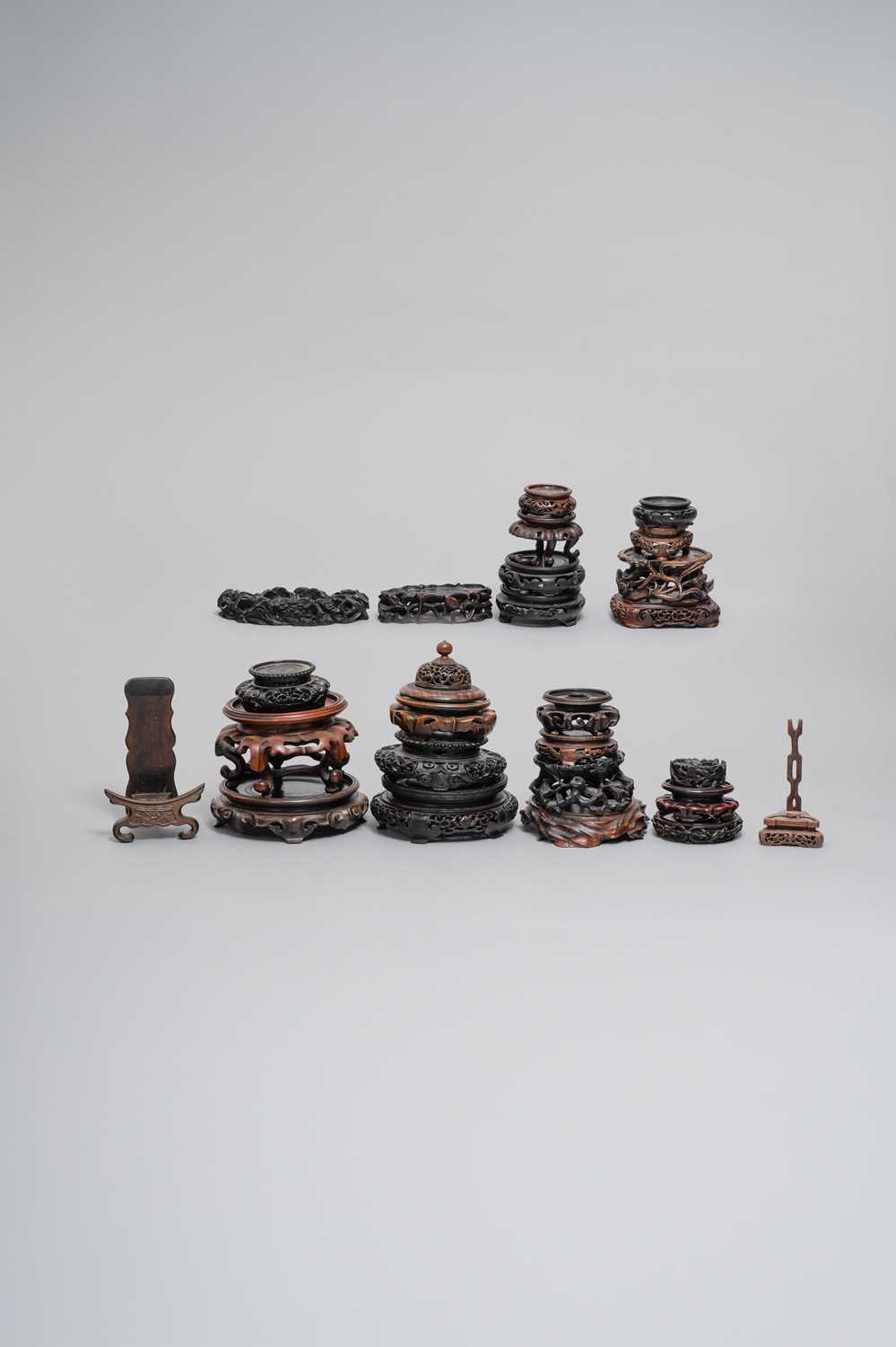 NO RESERVE TWENTY-FIVE CHINESE HARDWOOD STANDS QING DYNASTY AND LATER Together with a hardwood