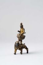 A CHINESE GILDED BRONZE FIGURE OF GUANYIN QING DYNASTY The bodhisattva raised high on a lotus