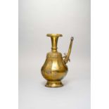 A TIBETAN GILT-COPPER EWER, PENBA HU 18TH/19TH CENTURY The twelve-sided pear-shaped body embossed