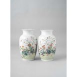 A PAIR OF CHINESE FAMILLE ROSE VASES 20TH CENTURY The bodies of ovoid form beneath waisted necks and