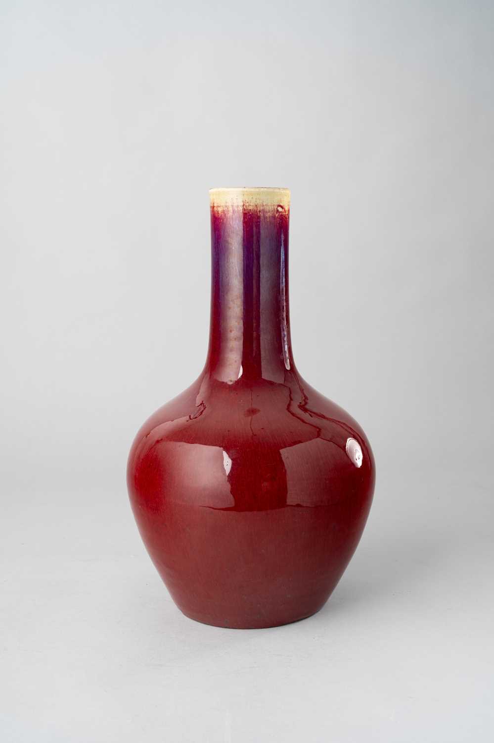NO RESERVE A CHINESE FLAMBE-GLAZED BOTTLE VASE QING DYNASTY The deep red streaked glaze thinning
