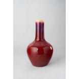 NO RESERVE A CHINESE FLAMBE-GLAZED BOTTLE VASE QING DYNASTY The deep red streaked glaze thinning