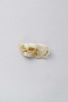 A PALE CELADON JADE 'TWIN CAT' GROUP QING DYNASTY Carved with two small cats reclining on a large