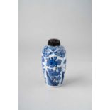 A SMALL CHINESE BLUE AND WHITE 'FLOWERS' VASE KANGXI 1662-1722 The ovoid body painted with four