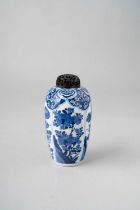 A SMALL CHINESE BLUE AND WHITE 'FLOWERS' VASE KANGXI 1662-1722 The ovoid body painted with four