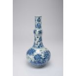 A CHINESE BLUE AND WHITE BOTTLE VASE TRANSITIONAL PERIOD C.1640 The body decorated with birds