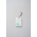 A CHINESE WHITE AND APPLE GREEN JADEITE RECTANGULAR PENDANT QING DYNASTY The pendant with a blank