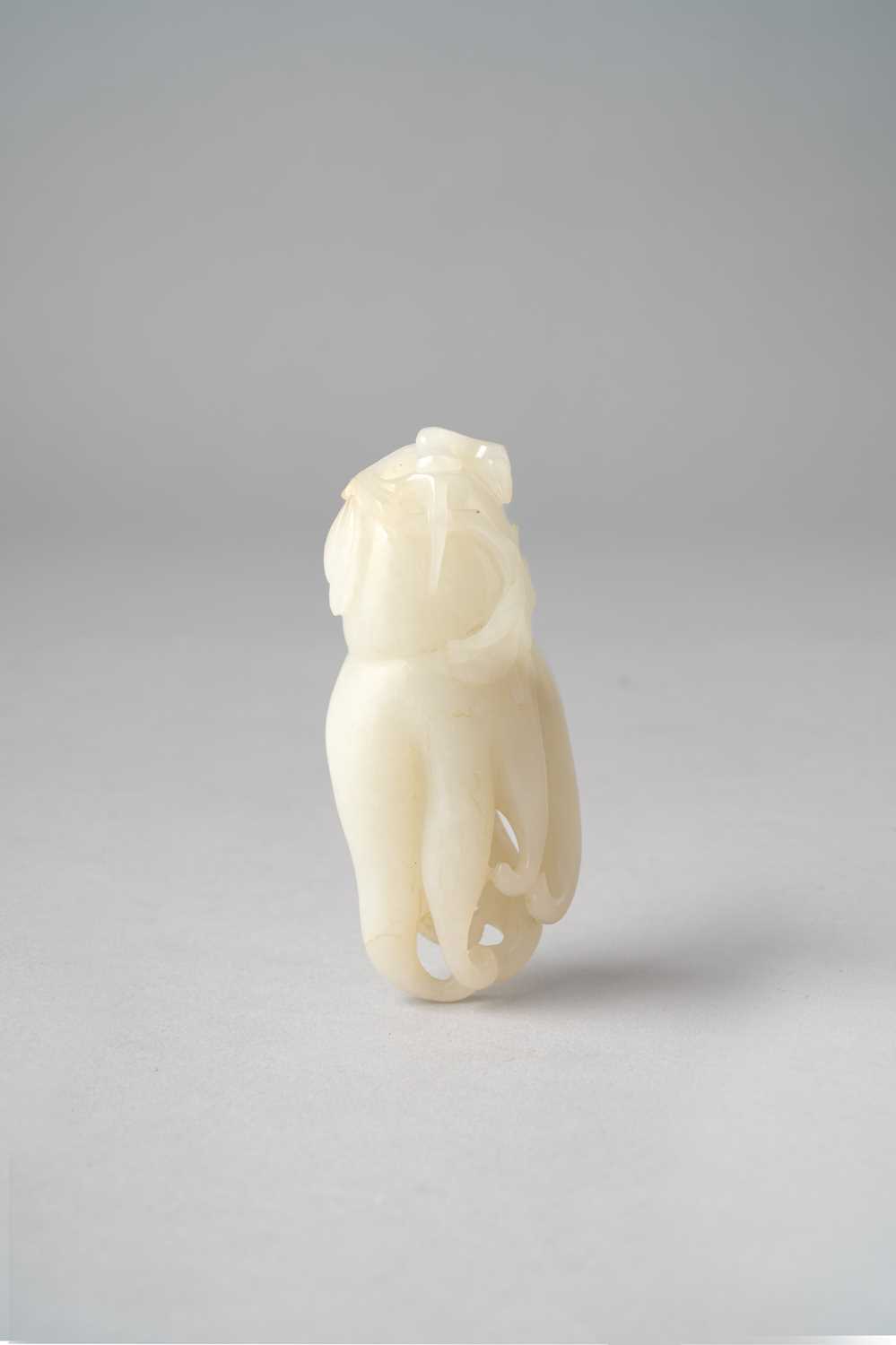 A CHINESE WHITE JADE CARVING OF A FINGER CITRON QING DYNASTY OR LATER Carved as a large finger