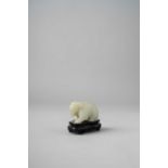 A CHINESE PALE CELADON JADE CARVING OF AN ELEPHANT QING DYNASTY The pachyderm slightly crouched,
