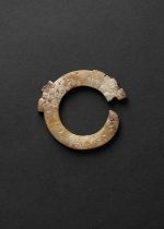 A CHINESE JADE 'DRAGON' PENDANT WARRING STATES PERIOD OR LATER Of circular form, carved as a