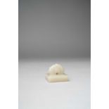 A CHINESE WHITE JADE SQUARE SEAL QING DYNASTY OR LATER Carved with a flame-shaped finial, the seal