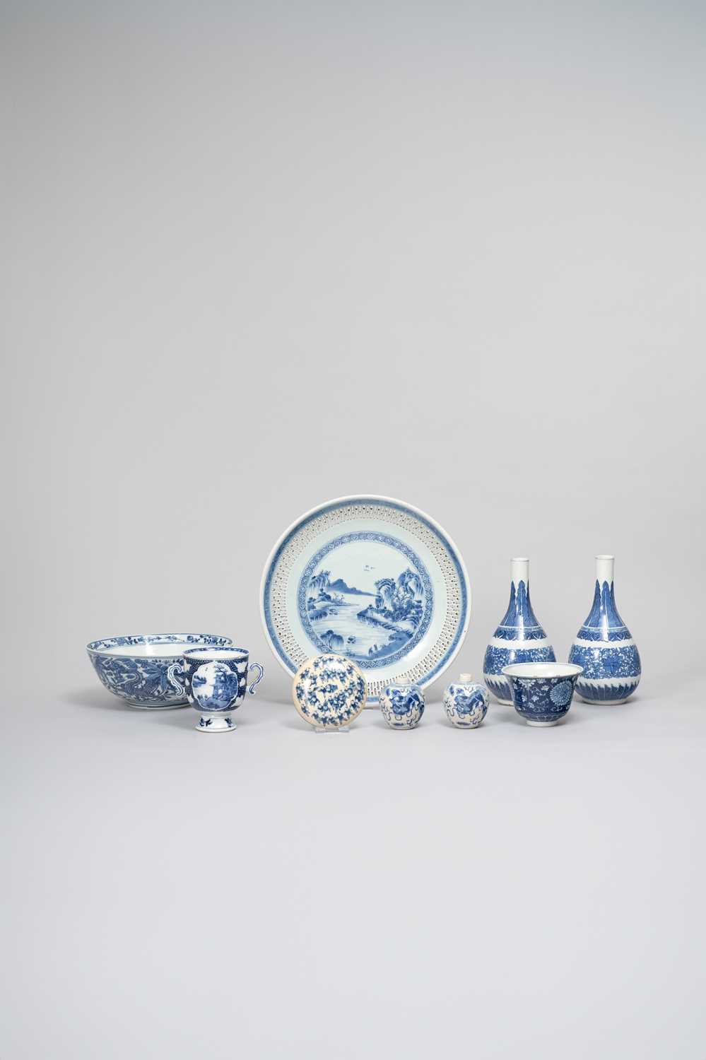NINE CHINESE BLUE AND WHITE ITEMS QING DYNASTY Comprising: a reticulated dish with a landscape