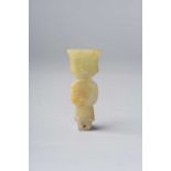 A CHINESE YELLOW JADE ARCHAIC FIGURAL PENDANT POSSIBLY WESTERN ZHOU DYNASTY Carved as a figure