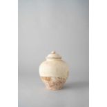 NO RESERVE A CHINESE POTTERY OVOID JAR AND COVER TANG DYNASTY Decorated with a cream-colour glaze,