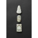 THREE CHINESE CELADON JADE PENDANTS QING DYNASTY One carved as a gourd, decorated in low relief with