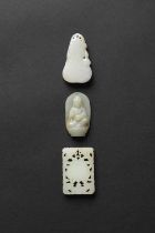 THREE CHINESE CELADON JADE PENDANTS QING DYNASTY One carved as a gourd, decorated in low relief with