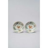 A PAIR OF CHINESE FAMILLE ROSE 'BUTTERFLY' SAUCERS 19TH CENTURY Each with a lobed rim, painted