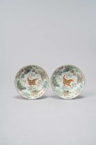 A PAIR OF CHINESE FAMILLE ROSE 'BUTTERFLY' SAUCERS 19TH CENTURY Each with a lobed rim, painted