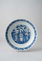 A LARGE CHINESE BLUE AND WHITE DISH LATE MING DYNASTY Decorated to the well with a rocky