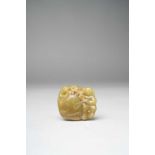 A CHINESE YELLOW JADE 'BOYS AND DRUM' GROUP QING DYNASTY OR LATER Carved in openwork with two boys