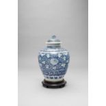 A CHINESE BLUE AND WHITE JAR AND COVER LATE MING DYNASTY Painted with bands of chrysanthemums