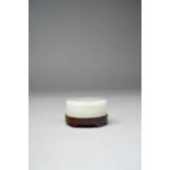 A CHINESE WHITE JADE CIRCULAR BOX AND COVER QING DYNASTY OR LATER The plain box of shallow form,