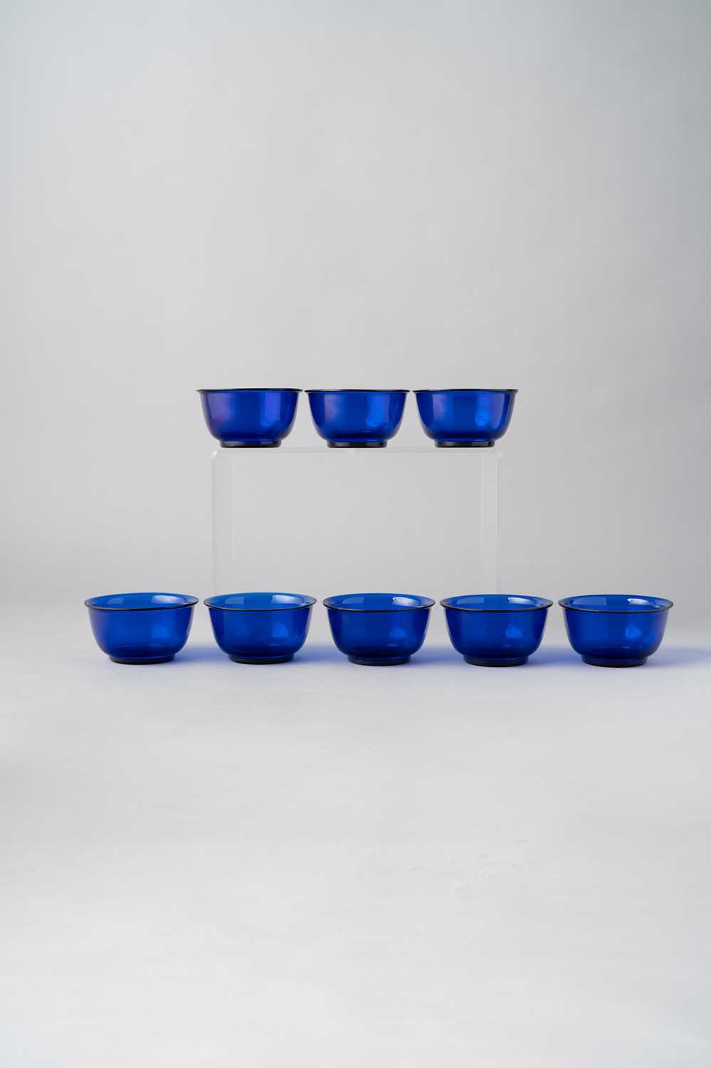 A SET OF EIGHT CHINESE BLUE BEIJING GLASS BOWLS LATE QING DYNASTY/ REPUBLIC PERIOD Each with rounded