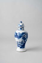 A CHINESE BLUE AND WHITE BALUSTER VASE AND COVER KANGXI 1662-1722 Painted with two panels containing