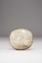A CHINESE WHITE JADE OVAL PLAQUE QING DYNASTY The domed oval plaque carved in relief with a sage