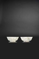 A PAIR OF CHINESE TRANSLUCENT JADEITE BOWLS LATE QIANLONG Each carved from a superb pale grey-