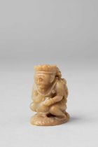 A CHINESE CELADON JADE CARVING OF GARUDA POSSIBLY YUAN DYNASTY The crouching mythical bird figure