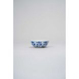 A CHINESE BLUE AND WHITE SHALLOW CUP XUANTONG, DATED 1909 The rounded sides decorated with eight