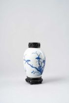 A CHINESE BLUE AND WHITE OVOID JAR TRANSITIONAL PERIOD C.1640 Painted with birds perched in