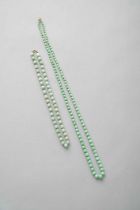 TWO CHINESE JADEITE GRADUATED NECKLACES 20TH CENTURY One an apple green jadeite necklace, formed
