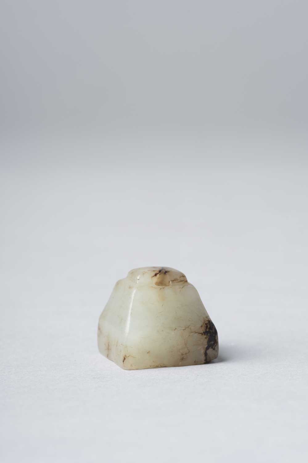 A SMALL CHINESE ARCHAIC CELADON JADE SEAL HAN DYNASTY The square base rising to a trapezoidal