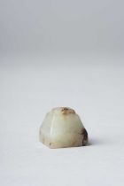 A SMALL CHINESE ARCHAIC CELADON JADE SEAL HAN DYNASTY The square base rising to a trapezoidal