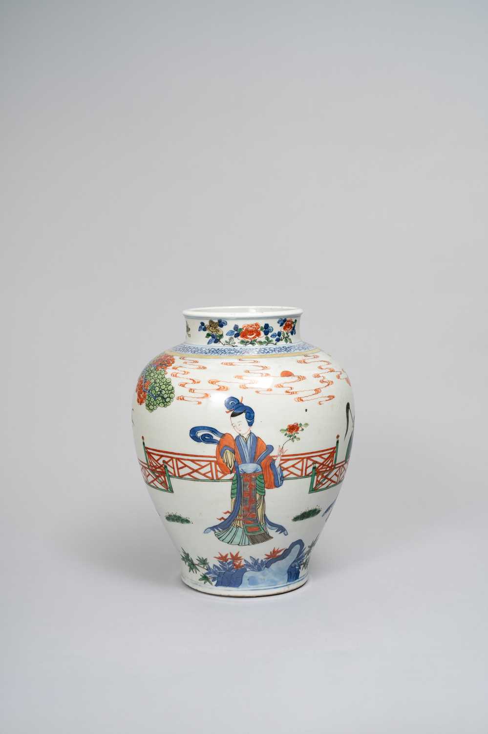 A CHINESE WUCAI 'IMMORTALS' JAR LATE QING DYNASTY Painted with ladies in a fenced garden amongst