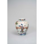 A CHINESE WUCAI 'IMMORTALS' JAR LATE QING DYNASTY Painted with ladies in a fenced garden amongst