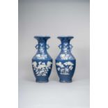 A PAIR OF LARGE CHINESE REVERSE-DECORATED VASES LATE QING DYNASTY Decorated in raised and incised