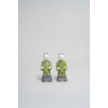 A PAIR OF CHINESE FAMILLE ROSE STANDING FIGURES OF BOYS LATE 18TH CENTURY Each modelled with a
