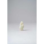 A CHINESE PALE CELADON JADE FIGURAL PENDANT QING DYNASTY Depicting a man in scholar's robes and a