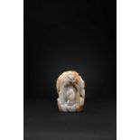 A CHINESE GREY AND RUSSET JADE BOULDER QING DYNASTY The God of Longevity is depicted leaning on a